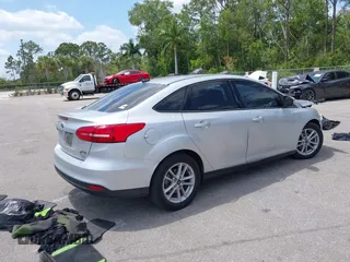 2018 Ford Focus SE z VIN 1FADP3FE9JL241661, wystawiony jako IAAI lot #42103513 z przebiegiem 117 003 mil mil oraz . Historia ofert i sprzedaży dostępna na DreamBid. Obrazek 4.
