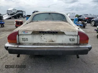 1989 Jaguar XJS z VIN SAJNY584XKC161154, wystawiony jako Copart lot #70912984 z przebiegiem 65 188 mil mil oraz Czysty tytuł • Clean title. Historia ofert i sprzedaży dostępna na DreamBid. Obrazek 6.