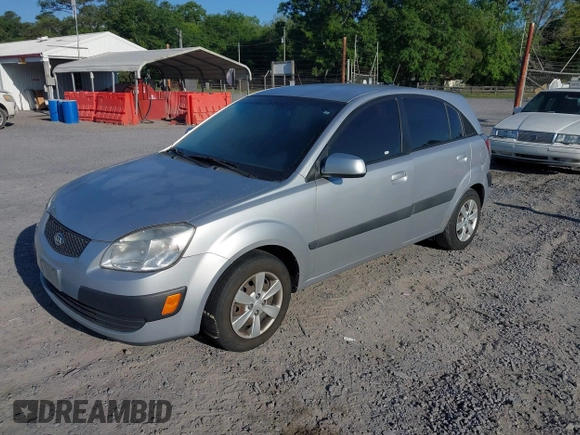 2009 Kia Rio LX with VIN KNADE243096440150, listed as a IAAI auction lot 42152589 with 114,484 mi miles. Bid and sale history available at carsss.com. Image 2.