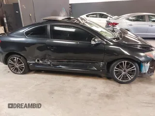 2010 Scion tC with VIN JTKDE3B77A0320585, listed as a IAAI auction lot 39883404 with 140,409 mi miles. Bid and sale history available at carsss.com. Image 14.