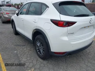 2019 Mazda CX-5 Sport with VIN JM3KFABM4K1565787, listed as a IAAI auction lot 42054585 with 80,580 mi miles and . Bid and sale history available at DreamBid. Image 3.