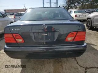 1997 Mercedes-Benz E-Class with VIN WDBJF72F8VA462335, listed as a Copart auction lot 50230895 with 97,831 mi miles and Salvage Title. Bid and sale history available at carsss.com. Image 6.