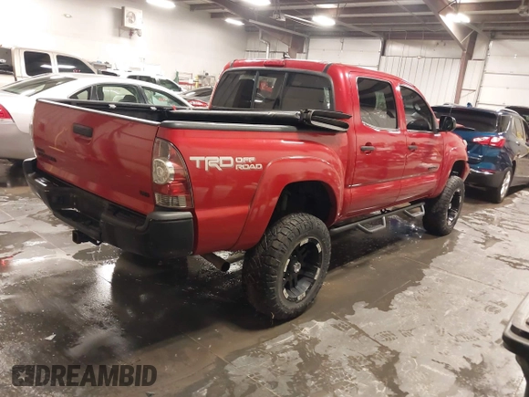 2015 Toyota Tacoma with VIN 3TMLU4EN3FM196518, listed as a IAAI auction lot 41198481 with 96,277 mi miles and . Bid and sale history available at DreamBid. Image 4.