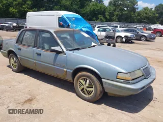 1991 Pontiac Grand Am with VIN 1G2NE54UXMC657320, listed as a IAAI auction lot 42811592 with 188,153 mi miles and . Bid and sale history available at DreamBid. Image 1.