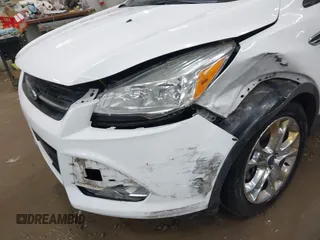 2014 Ford Escape SE with VIN 1FMCU9G99EUC15477, listed as a IAAI auction lot 42147162 with 98,886 mi miles and . Bid and sale history available at DreamBid. Image 6.