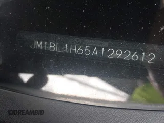 2010 Mazda 3 S Sport z VIN JM1BL1H65A1292612, wystawiony jako IAAI lot #42379657 z przebiegiem 148 056 mil mil oraz . Historia ofert i sprzedaży dostępna na DreamBid. Obrazek 9.