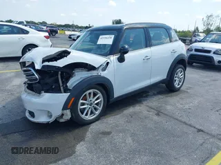 2015 MINI Countryman z VIN WMWZB3C53FWR43884, wystawiony jako IAAI lot #42336430 z przebiegiem 111 934 mil mil oraz . Historia ofert i sprzedaży dostępna na DreamBid. Obrazek 2.