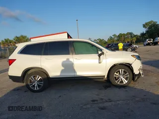 2017 Honda Pilot EX-L with VIN 5FNYF6H51HB037690, listed as a IAAI auction lot 41976359 with 126,055 mi miles and . Bid and sale history available at DreamBid. Image 13.