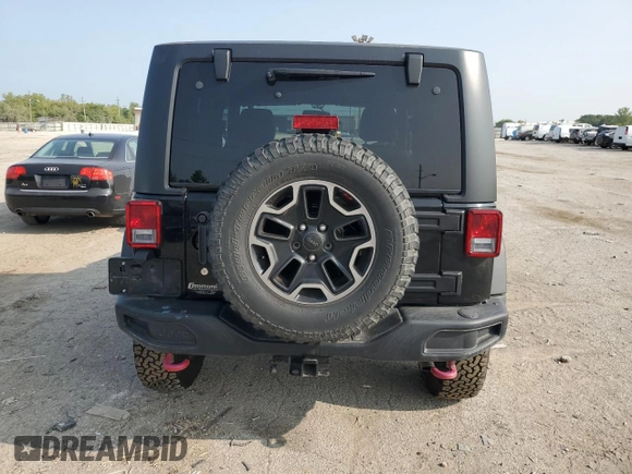2015 Jeep Wrangler Rubicon Hard Rock z VIN 1C4BJWCG9FL714606, wystawiony jako Copart lot #68521014 z przebiegiem 35 187 mil mil oraz Szkoda całkowita • Salvage title. Historia ofert i sprzedaży dostępna na DreamBid. Obrazek 6.