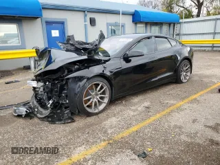 2022 Tesla Model S Plaid with VIN 5YJSA1E69NF477754, listed as a Copart auction lot 83974254 with Not Provided miles and Salvage Title. Bid and sale history available at carsss.com. Image 1.