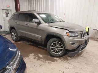 2016 Jeep Grand Cherokee Limited 75th Anniversary with VIN 1C4RJFBG6GC453307, listed as a IAAI auction lot 41657982 with 141,647 mi miles. Bid and sale history available at carsss.com. Image 1.