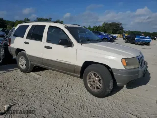 2002 Jeep Grand Cherokee Laredo with VIN 1J4GW48S12C312348, listed as a Copart auction lot 51786715 with 229,698 mi miles and Clean Title. Bid and sale history available at carsss.com. Image 4.