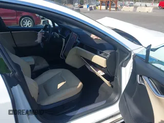2016 Tesla Model S 90D with VIN 5YJSA1E26GF147327, listed as a IAAI auction lot 42077766 with 89,502 mi miles and . Bid and sale history available at DreamBid. Image 5.