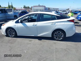 2020 Toyota Prius L Eco with VIN JTDKARFUXL3107211, listed as a IAAI auction lot 42797561 with 328,023 mi miles and . Bid and sale history available at DreamBid. Image 14.