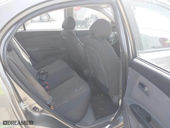 2011 Kia Rio LX with VIN KNADH4A39B6923388, listed as a IAAI auction lot 42060176 with 98,690 mi miles. Bid and sale history available at carsss.com. Image 8.