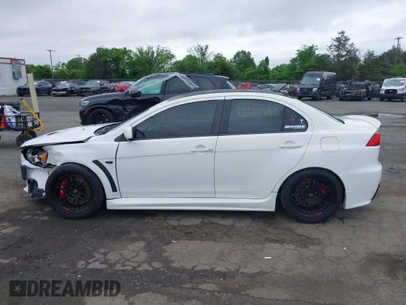 2013 Mitsubishi Lancer Evolution GSR z VIN JA32W8FV0DU023509, wystawiony jako IAAI lot #42222552 z przebiegiem 128 030 mil mil oraz . Historia ofert i sprzedaży dostępna na DreamBid. Obrazek 14.