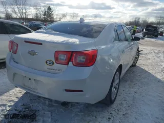 2015 Chevrolet Malibu LTZ with VIN 1G11F5SL5FF237461, listed as a IAAI auction lot 41579154 with 103,670 mi miles. Bid and sale history available at carsss.com. Image 4.