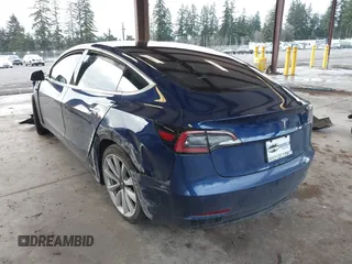 2018 Tesla Model 3 Long Range Battery z VIN 5YJ3E1EA7JF035949, wystawiony jako IAAI lot #41627027 z przebiegiem Nie podano mil oraz . Historia ofert i sprzedaży dostępna na DreamBid. Obrazek 3.