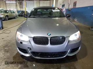 2011 BMW 3 Series 335is with VIN WBAKG1C56BE599457, listed as a Copart auction lot 52412655 with 134,497 mi miles and Clean title. Bid and sale history available at DreamBid. Image 5.