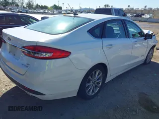 2018 Ford Fusion SE z VIN 3FA6P0LU3JR102971, wystawiony jako IAAI lot #41814321 z przebiegiem 135 472 mil mil oraz . Historia ofert i sprzedaży dostępna na DreamBid. Obrazek 4.