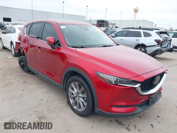 2020 Mazda CX-5 Grand Touring with VIN JM3KFADM7L0729537, listed as a IAAI auction lot 41864569 with 82,998 mi miles. Bid and sale history available at carsss.com. Image 1.