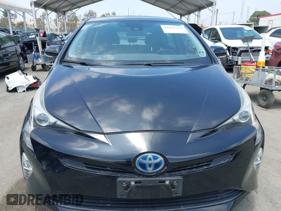 2017 Toyota Prius Two with VIN JTDKARFUXH3041668, listed as a IAAI auction lot 42421754 with 57,677 mi miles and . Bid and sale history available at DreamBid. Image 13.