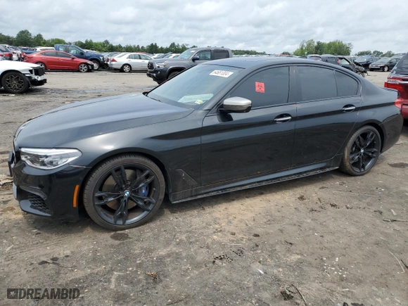 2018 BMW 5 Series M550i xDrive with VIN WBAJB9C51JB286700, listed as a Copart auction lot 64681004 with 76,304 mi miles and Salvage Title. Bid and sale history available at carsss.com. Image 1.