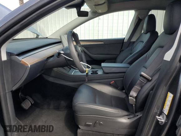 2023 Tesla Model Y Long Range z VIN 7SAYGAEE7PF714828, wystawiony jako Copart lot #89210485 z przebiegiem 42 256 mil mil oraz Szkoda całkowita • Salvage title. Historia ofert i sprzedaży dostępna na DreamBid. Obrazek 7.