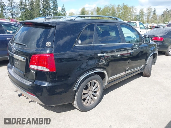 2012 Kia Sorento SX with VIN 5XYKWDA26CG258262, listed as a IAAI auction lot 42068704 with 124,832 mi miles. Bid and sale history available at carsss.com. Image 4.