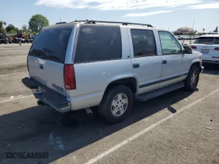 1995 Chevrolet Tahoe with VIN 1GNEK13K6SJ415105, listed as a Copart auction lot 65960124 with 219,821 mi miles and Salvage Title. Bid and sale history available at carsss.com. Image 3.