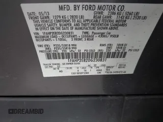 2013 Ford Taurus SEL with VIN 1FAHP2E82DG230831, listed as a IAAI auction lot 42078978 with 207,075 mi miles and . Bid and sale history available at carsss.com. Image 9.