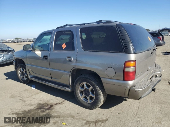 2003 GMC Yukon Denali z VIN 1GKEK63U93J339277, wystawiony jako Copart lot #42454275 z przebiegiem Nie podano mil oraz Szkody całkowita. Historia ofert i sprzedaży dostępna na DreamBid. Obrazek 2.