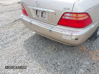 2001 Acura RL w/Navigation System z VIN JH4KA96661C002128, wystawiony jako IAAI lot #42000924 z przebiegiem 180 205 mil mil oraz . Historia ofert i sprzedaży dostępna na DreamBid. Obrazek 6.