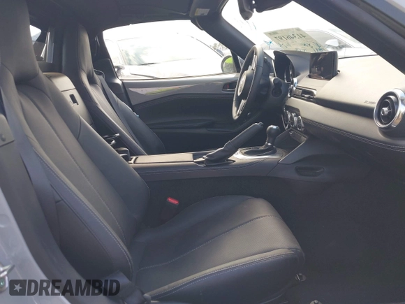 2024 Mazda MX-5 Miata Grand Touring z VIN JM1NDAM76R0602860, wystawiony jako IAAI lot #41346197 z przebiegiem 1 891 mil mil oraz . Historia ofert i sprzedaży dostępna na DreamBid. Obrazek 8.