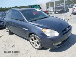2007 Hyundai Accent SE z VIN KMHCN36C27U050012, wystawiony jako IAAI lot #42112316 z przebiegiem 172 070 mil mil oraz . Historia ofert i sprzedaży dostępna na DreamBid. Obrazek 1.