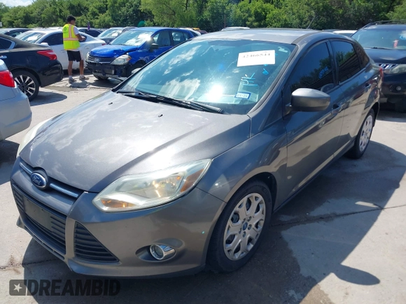 2012 Ford Focus SE with VIN 1FAHP3F28CL211898, listed as a IAAI auction lot 42466544 with 142,933 mi miles and . Bid and sale history available at DreamBid. Image 2.