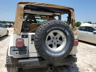 2001 Jeep Wrangler Sahara z VIN 1J4FA59S81P321490, wystawiony jako Copart lot #57320005 z przebiegiem 180 959 mil mil oraz Szkoda całkowita • Salvage title. Historia ofert i sprzedaży dostępna na DreamBid. Obrazek 6.