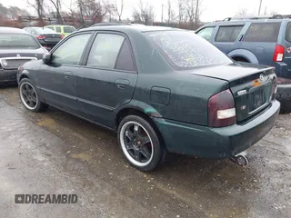 2000 Mazda Protege DX with VIN JM1BJ2225Y0255349, listed as a IAAI auction lot 41604895 with Not Provided miles and . Bid and sale history available at DreamBid. Image 3.
