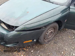 1997 Saturn SC z VIN 1G8ZG1277VZ342397, wystawiony jako IAAI lot #41966570 z przebiegiem 184 054 mil mil oraz . Historia ofert i sprzedaży dostępna na DreamBid. Obrazek 13.