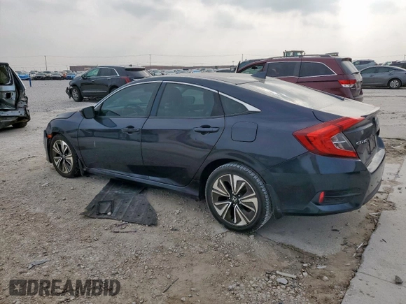 2016 Honda Civic EX-T z VIN 19XFC1F37GE012186, wystawiony jako Copart lot #51590575 z przebiegiem 121 041 mil mil oraz Szkoda całkowita • Salvage title. Historia ofert i sprzedaży dostępna na DreamBid. Obrazek 2.
