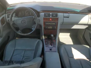 1999 Mercedes-Benz E-Class with VIN WDBJH65F1XA811693, listed as a Copart auction lot 69370604 with 128,876 mi miles and Salvage Title. Bid and sale history available at carsss.com. Image 8.