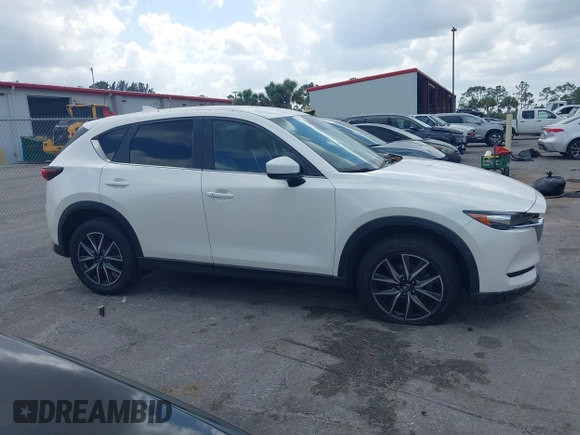 2018 Mazda CX-5 Touring z VIN JM3KFACM6J1419663, wystawiony jako IAAI lot #41879677 z przebiegiem 115 224 mil mil oraz . Historia ofert i sprzedaży dostępna na DreamBid. Obrazek 13.