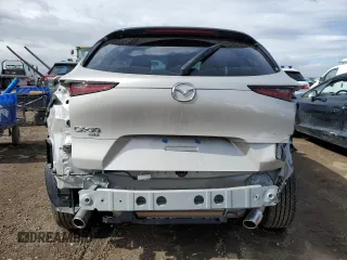 2022 Mazda CX-30 S Premium with VIN 3MVDMBDL4NM447276, listed as a Copart auction lot 47527985 with 4,577 mi miles and Salvage Title. Bid and sale history available at carsss.com. Image 6.