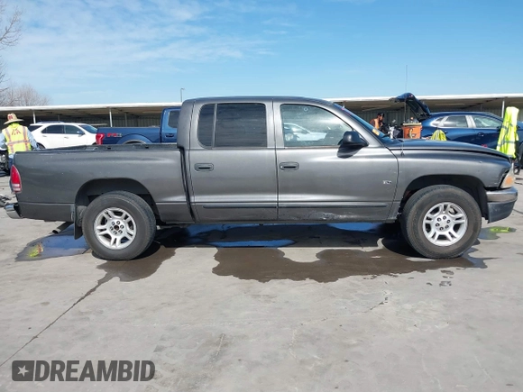 2001 Dodge Dakota z VIN 1B7HL2AX51S333575, wystawiony jako IAAI lot #41782582 z przebiegiem 291 640 mil mil oraz . Historia ofert i sprzedaży dostępna na DreamBid. Obrazek 13.