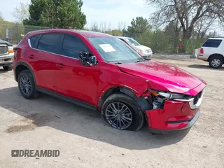 2020 Mazda CX-5 Touring z VIN JM3KFBCM2L0846174, wystawiony jako IAAI lot #42203758 z przebiegiem 58 617 mil mil oraz . Historia ofert i sprzedaży dostępna na DreamBid. Obrazek 1.