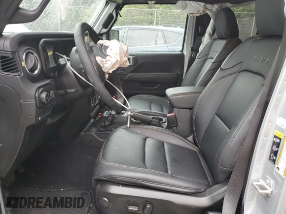 2024 Jeep Wrangler Sahara with VIN 1C4RJXP65RW210689, listed as a Copart auction lot 66482724 with 4,872 mi miles and Salvage Title. Bid and sale history available at DreamBid. Image 7.