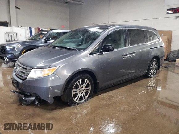 2012 Honda Odyssey EX-L with VIN 5FNRL5H69CB143572, listed as a Copart auction lot 48614255 with 114,490 mi miles and Salvage Title. Bid and sale history available at carsss.com. Image 1.