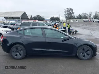 2023 Tesla Model 3 with VIN 5YJ3E1EA0PF587656, listed as a IAAI auction lot 41489586 with 12,844 mi miles and . Bid and sale history available at DreamBid. Image 14.