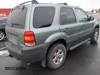 2006 Ford Escape XLT with VIN 1FMYU03126KC55897, listed as a IAAI auction lot 41733243 with 136,989 mi miles. Bid and sale history available at carsss.com. Image 4.
