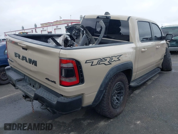 2022 Ram 1500 TRX with VIN 1C6SRFU92NN383774, listed as a IAAI auction lot 41788415 with 34,646 mi miles and . Bid and sale history available at DreamBid. Image 4.